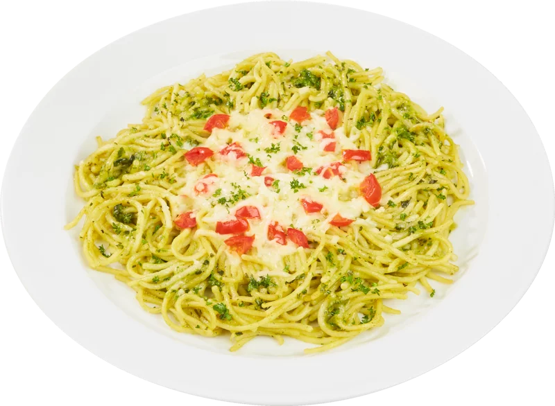 Spaghetti mit grünem Pesto und einer Käse-Tomaten-Garnitur